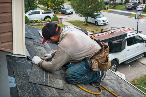 Professional Roof Replacement technician working in Winchester Center, CT